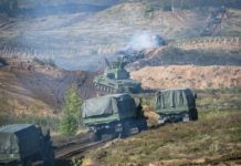 Vladimir Putin watches display of Russian firepower near EU border