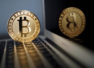 Bitcoin soars to record high above $6,000