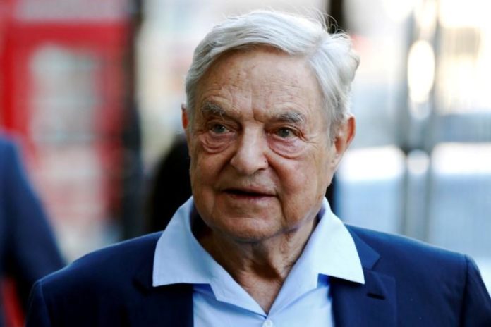 FILE PHOTO: Business magnate George Soros arrives to speak at the Open Russia Club in London