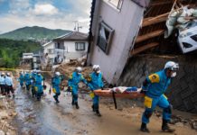 Japan prime minister says death toll from floods tops 100