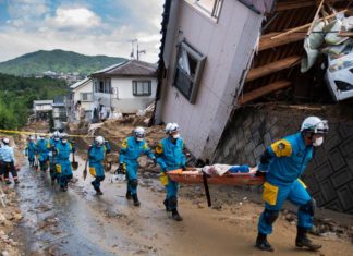 Japan prime minister says death toll from floods tops 100